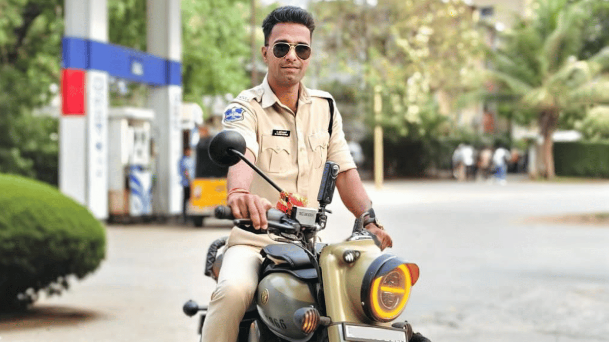 Traffic police officer Naveen Singh recording a moto vlog during a road stop, capturing real-time traffic interaction and road safety awareness through a helmet-mounted camera.