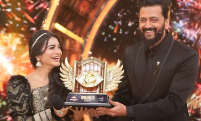 Tanvi Kolte celebrates her victory after winning Bigg Boss Marathi Season 6, holding the trophy on stage after defeating finalist Raqesh Bapat