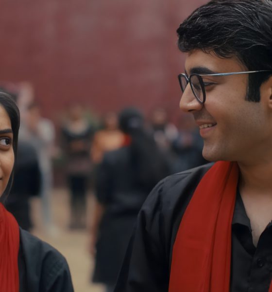 Actors performing a Nukkad Natak in a public street, engaging a crowd