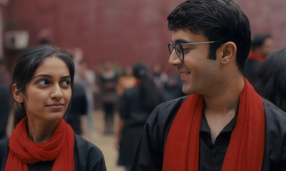 Actors performing a Nukkad Natak in a public street, engaging a crowd