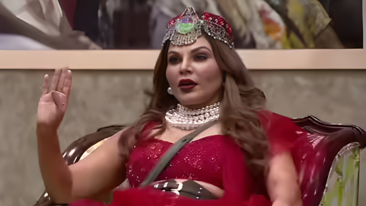 Indian reality TV personalities Rakhi Sawant and Raqesh Bapat during a Bigg Boss Marathi interaction, highlighting ongoing speculation about a possible romance between the two.